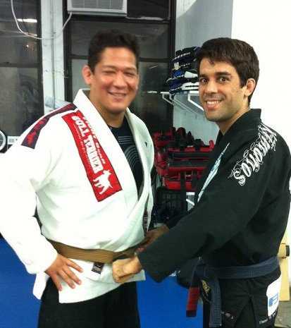 Christian Montes receiving his brown belt from Felipe Costa